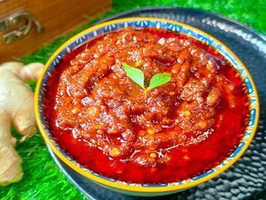 South Indian Adrak Chutney (Alam Pachadi) served in a bowl with red chillies and curry leaves – homemade ginger chutney recipe for idli and dosa.