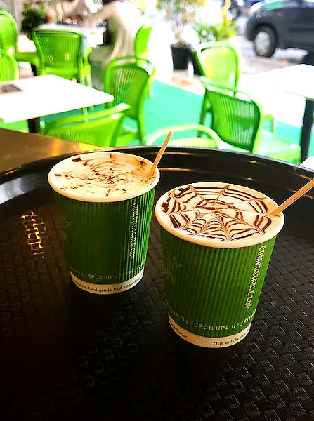 Glass of Irish coffee with cream topping.