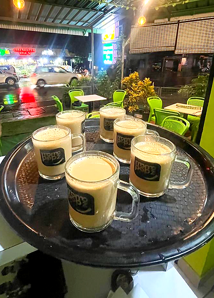 Hot Indian chai and flavored teas at Momo Popz Café in Ottapalam.