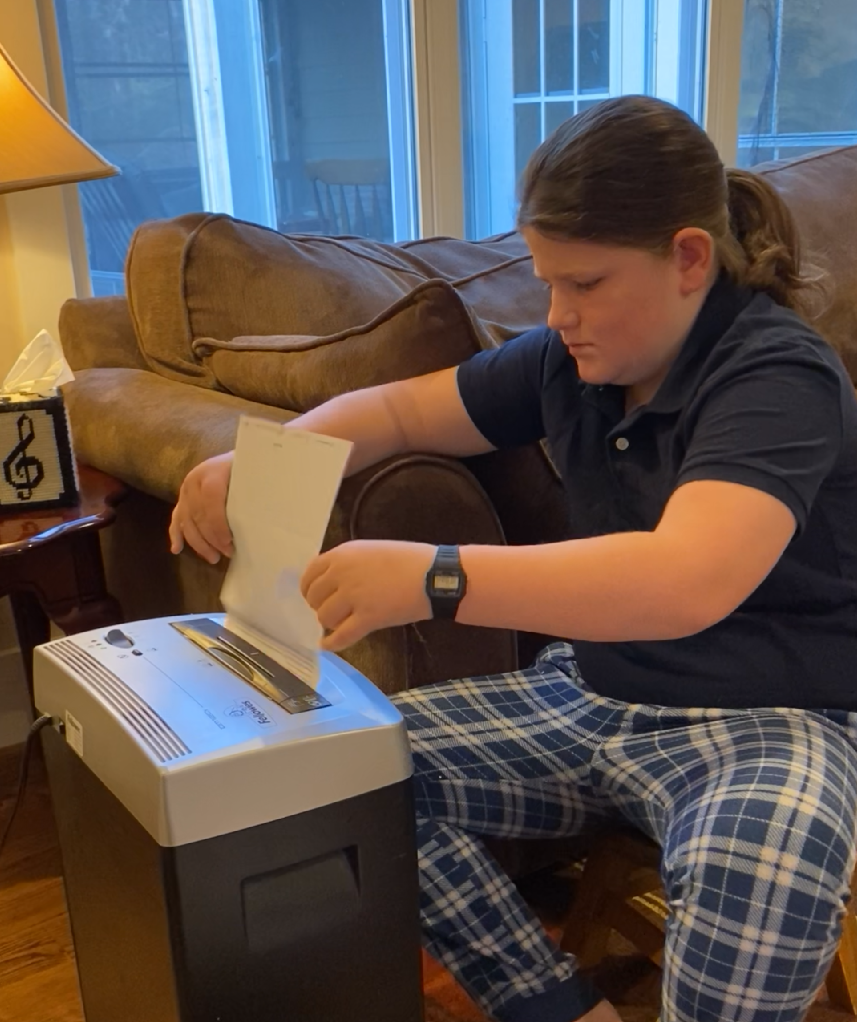 young entrepreneur shredding papers