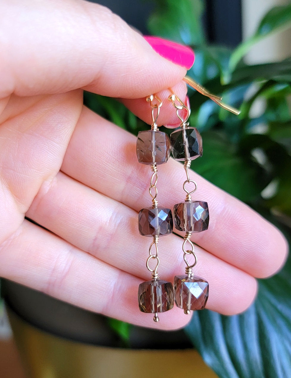Hand holding Smoky Quartz Drop Earrings