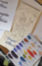 Color palette references with notes on paper and mid-done drawing, with printed letterings sketch