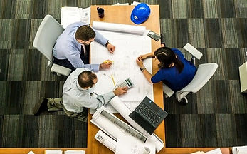 Workers working on a project in the office.