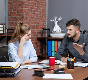 top-view-young-hardworking-management-co-workers-discussing-one-important-issue-office-env
