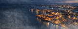 Industrial port at night for security risk consulting services