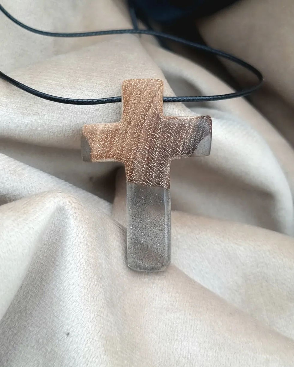 Wooden cross pendant with visible grain details on a leather necklace. 43. Christian Shop