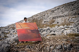 Artist Richard Hearns on the Burren with a painting