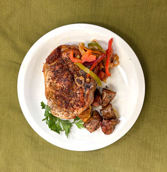 Chef Pete’s grilled pork chops, mix of peppers, and roasted potatoes