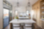 A bright modern kitchen with double islands
