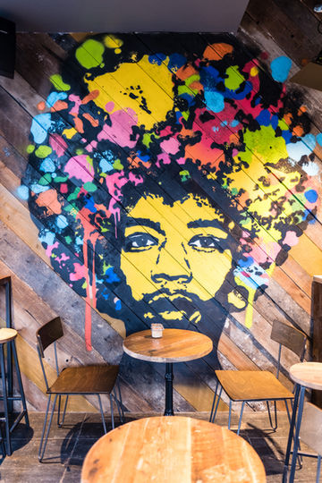 Creative interior featuring Black Sheep Coffee graffiti art.