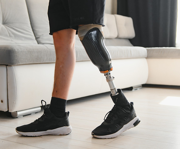 portrait-man-with-prosthetic-leg-home-copy-space.jpg