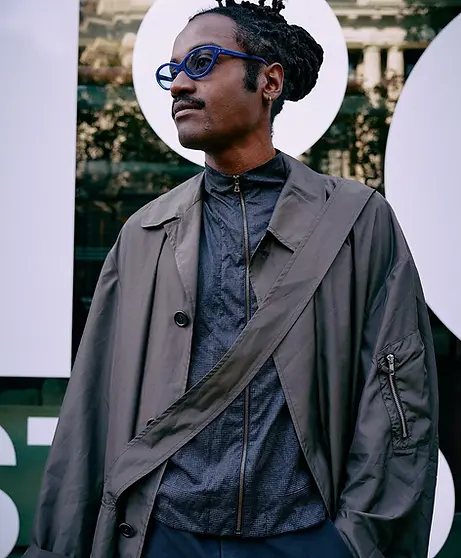 Patient wearing non-prescription sunglasses outdoors for comfort in bright conditions