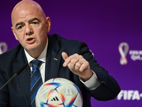 FIFA President Gianni Infantino addressing a press conference amidst growing legal and environmental controversies.