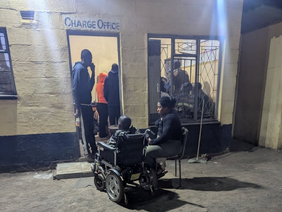 Musician Greatman during a police questioning.