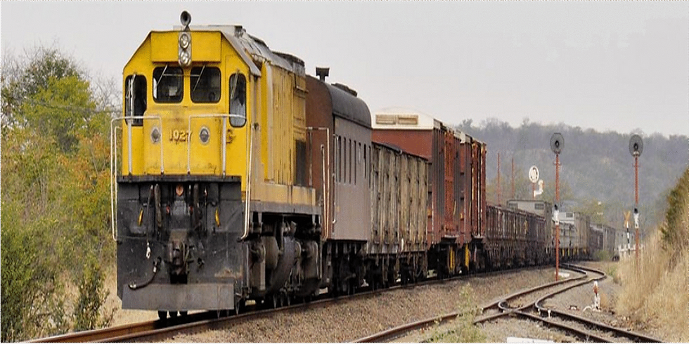 National Railways of Zimbabwe locomotive at level crossing