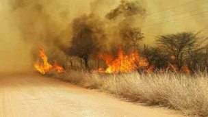 Veld fire burns dry grass in rural Buhera, Zimbabwe.