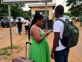 Travellers at an immigration checkpoint.