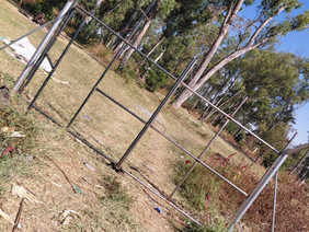 Contractors erecting a wire fence across an active river and wetland area in Mabelreign following a controversial High Court order.