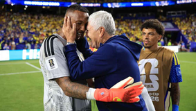 Eloy Room was embraced by Curaçao players and staff following his historic performance. Maja Hitij - FIFA/FIFA via Getty Images