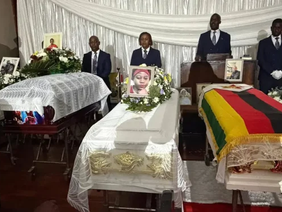 Three coffins of the deceased family members