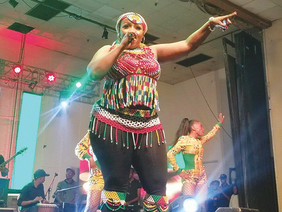 Sandra Nbebele performing live on stage
