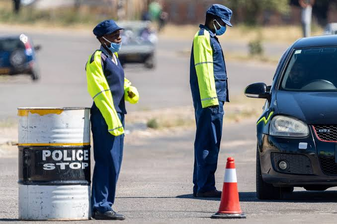 Traffic police conducting roadside checks in Zimbabwe.