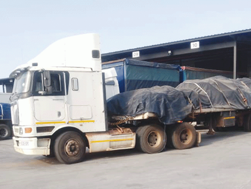 “Truck carrying mineral cargo on Zimbabwe highway”