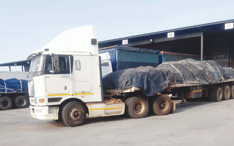 “Truck carrying mineral cargo on Zimbabwe highway”