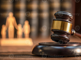 A wooden judge's gavel resting on a legal desk inside a Zimbabwean regional courthouse.