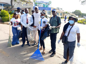 ZANU PF members and hospital staff cleaning the grounds of Sally Mugabe Hospital in Harare during National Clean Up Day.