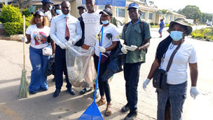 ZANU PF members and hospital staff cleaning the grounds of Sally Mugabe Hospital in Harare during National Clean Up Day.