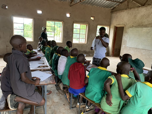 Zimbabwean school children attending lessons in a classroom.