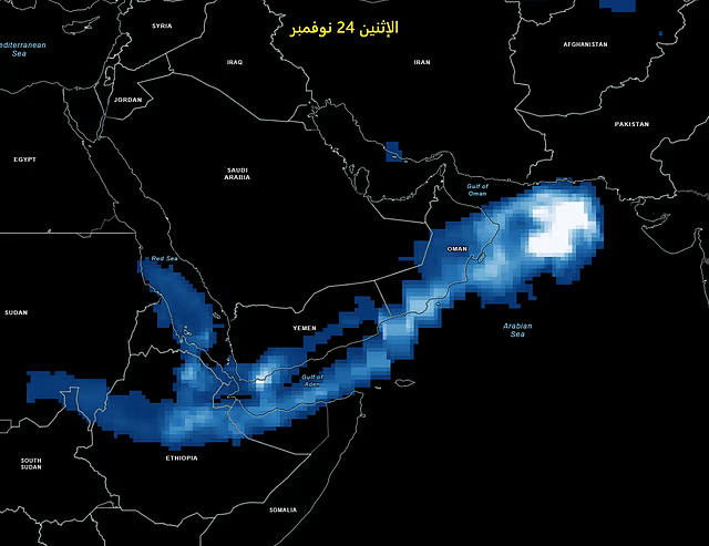 Map showing a weather pattern over the Middle East, with blue and white pixelated clouds. Text in Arabic at the top. Dark background.