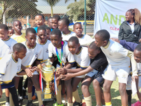 Samuel Centenary Junior School celebrating the Under-13 soccer title.