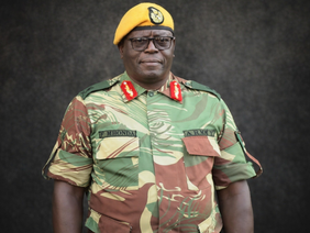 Major General Fidelis Mhonda receiving his new rank insignia.