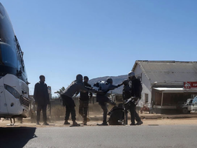 Police investigate Bolt Cutter bus crew assault at Musami Cross.
