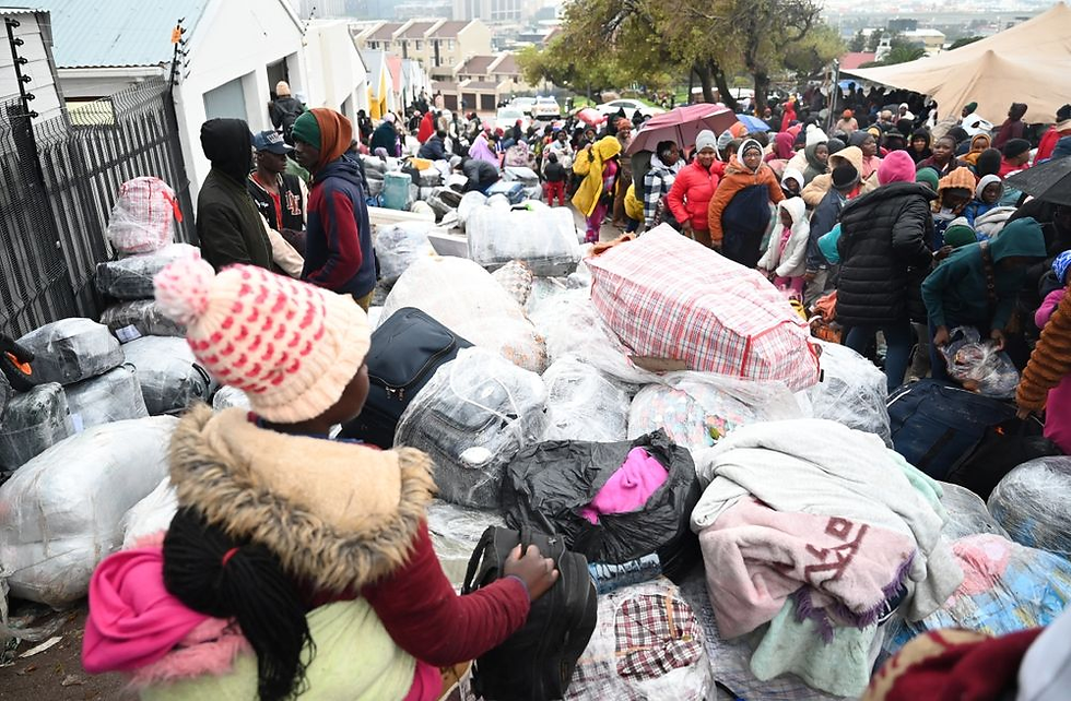 Zimbabwean nationals gathered outside the Zimbabwean Consulate in Cape Town.