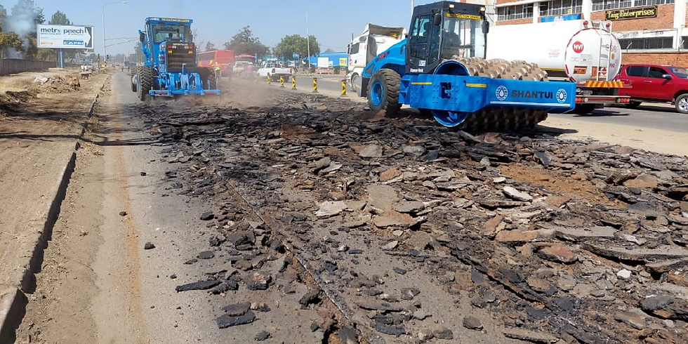 “Road construction equipment preparing for resurfacing project”