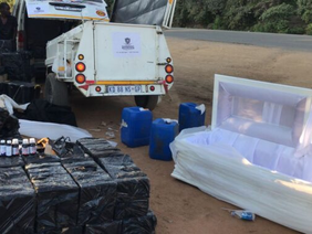 “Zimbabwe Republic Police officers conducting vehicle search at border”