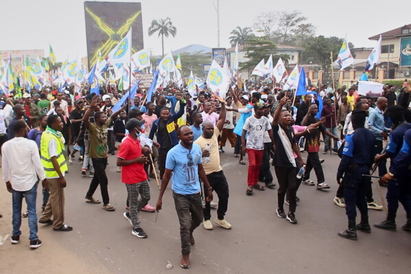 Opposition supporters and police clash during anti-government protests in Kinshasa over proposed constitutional changes in the Democratic Republic of Congo.