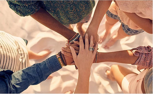 Multiple people's hands overlapping.