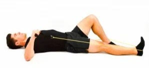 Man on floor doing rotator cuff exercise