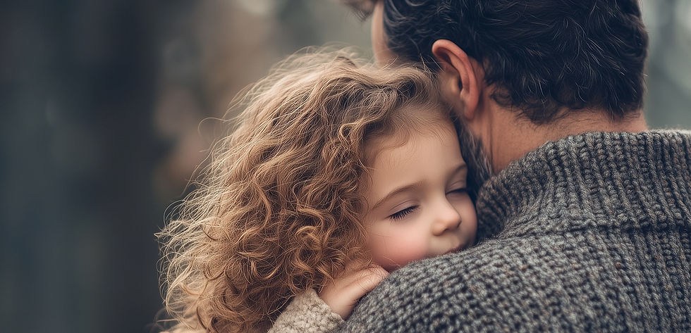 Young child with curly hair peacefully hugging an adult, conveying warmth and emotional safety.