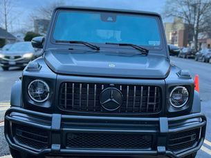 Black Mercedes G-Wagon parked on a New York City street showing the need for regular auto detailing