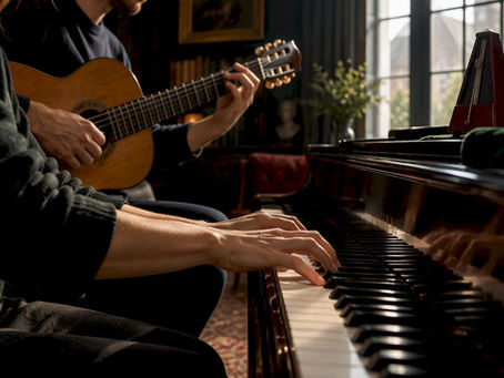 Hands practising scales on piano and guitar