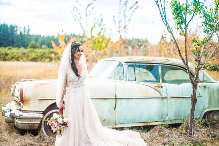 Bridal portrait with classic car