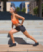 Vegan Softex Spiro Women's Shorts from Vegan Happy Clothing with subtle vegan logo showing workout pose