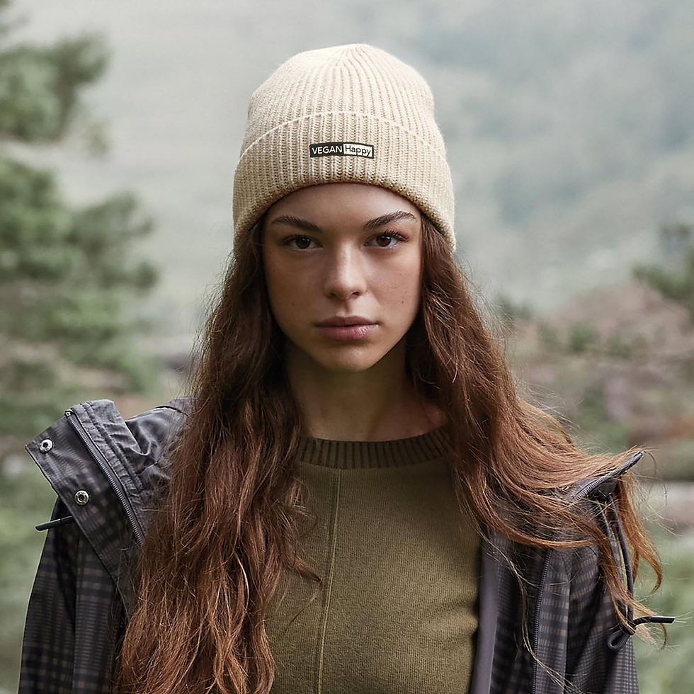 Vegan Engineered Ribbed Beanie on female model in cream with subtle vegan logo from Vegan Happy Clothing
