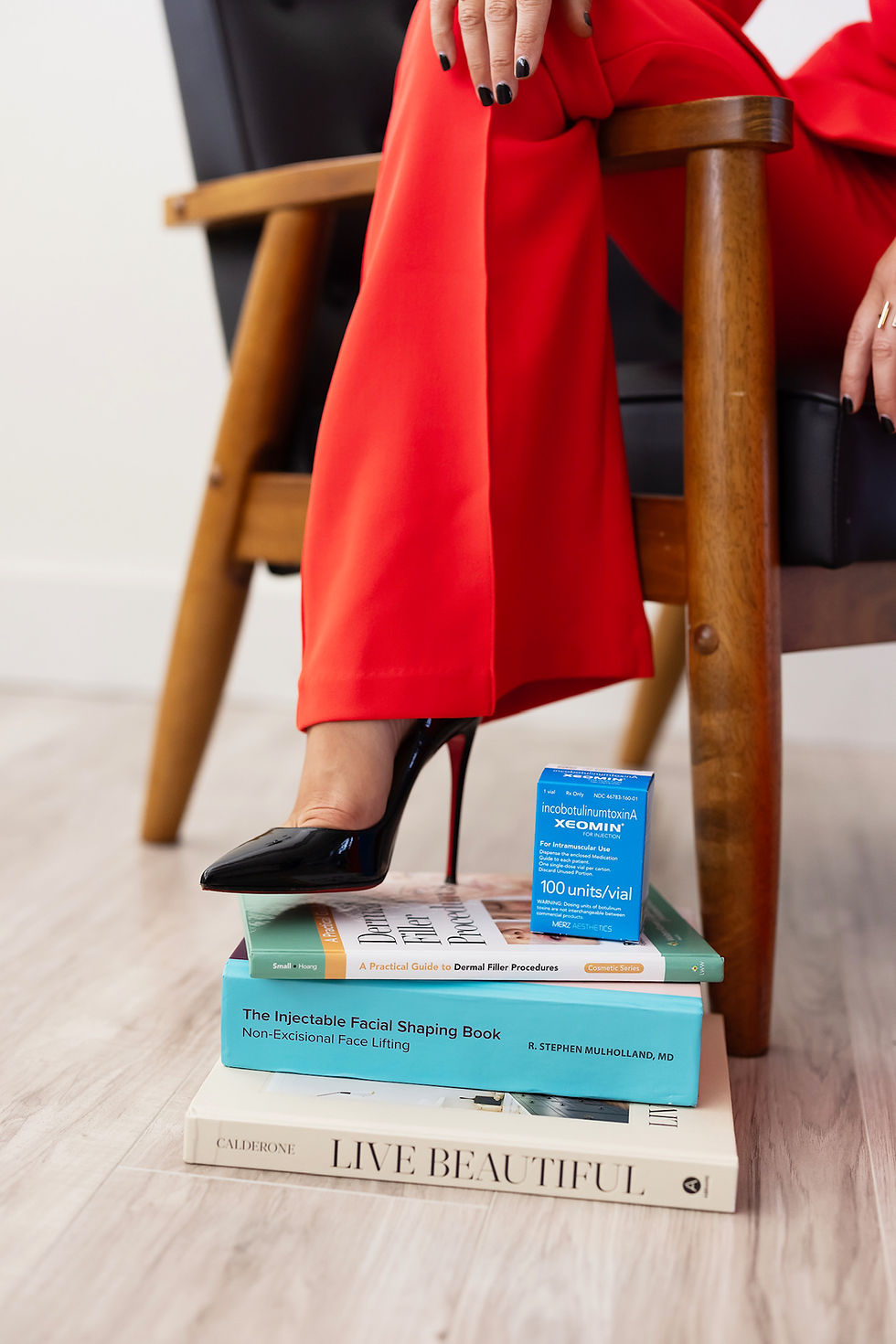 Elegant high heels resting on a Xiomara skincare box at Brilyn Medical Health & Anti-Aging, symbolizing confidence and refine