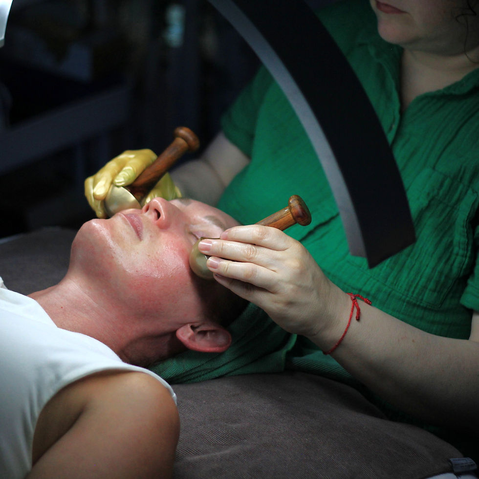 Amanda performing a facial massage with kansa wands